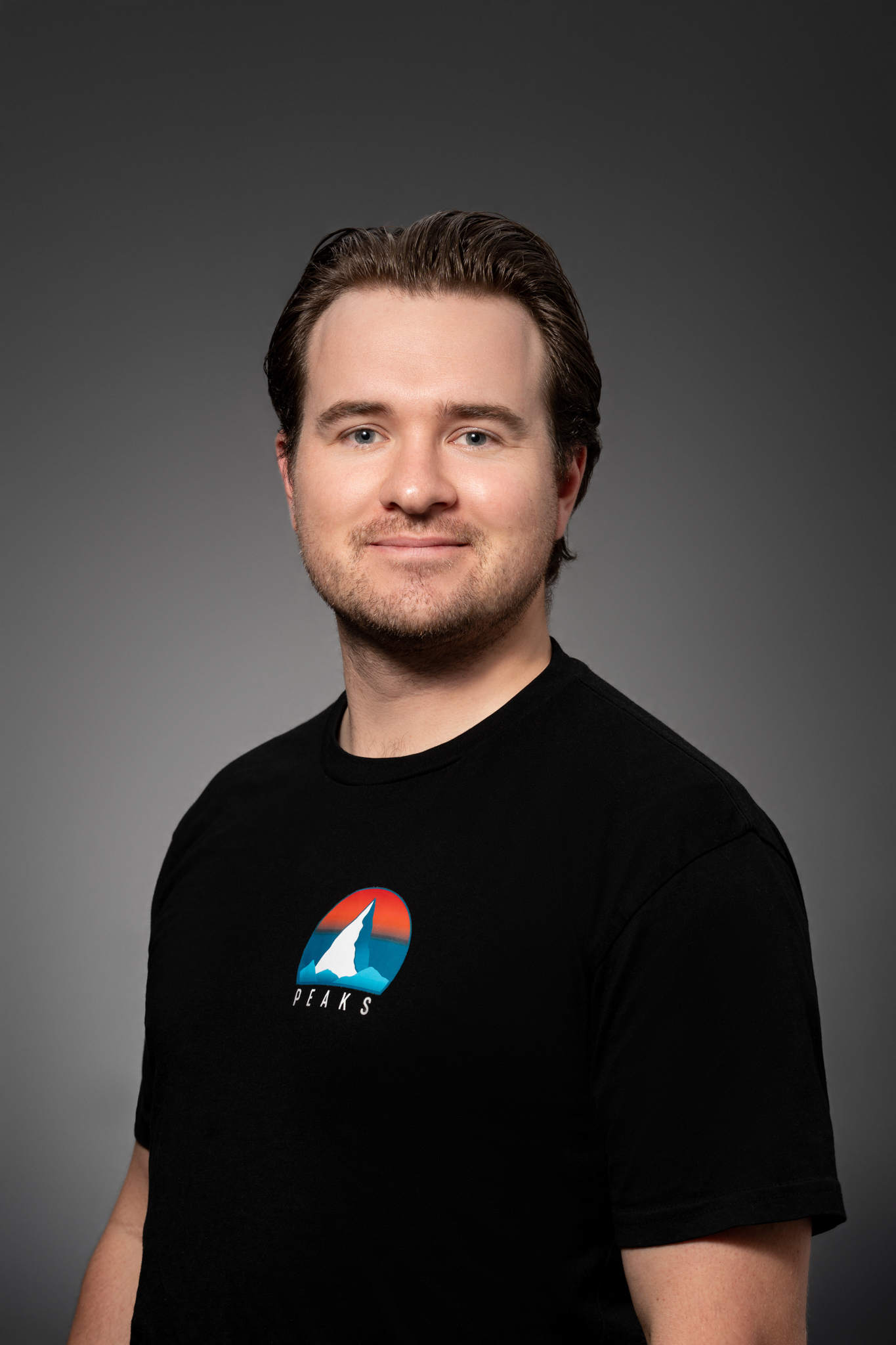 Michael Peacock wearing a Peaks Film Co. shirt